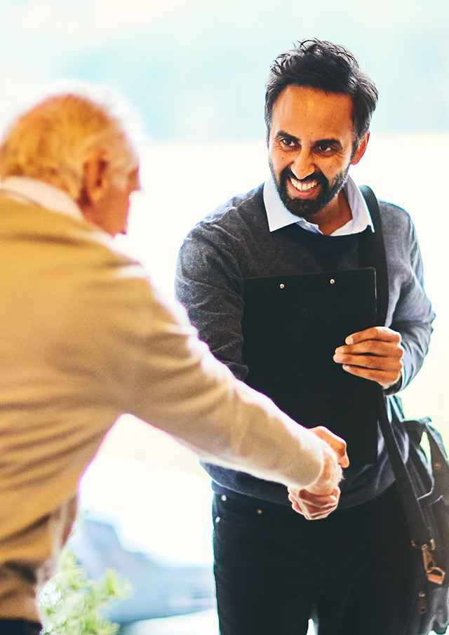 Image of two men shaking hands.